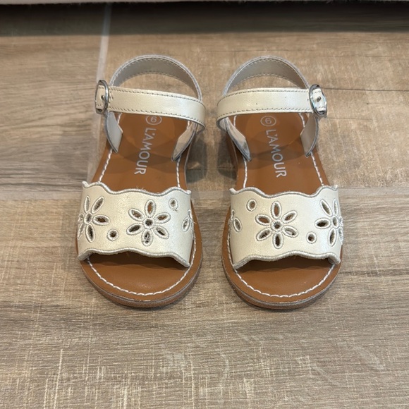 L'Amour Cream Sandals with Floral Cutouts
Augusta Embroidered Sandal - Picture 1 of 2